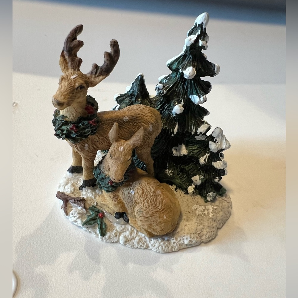 Two reindeer. Part of a Christmas village.